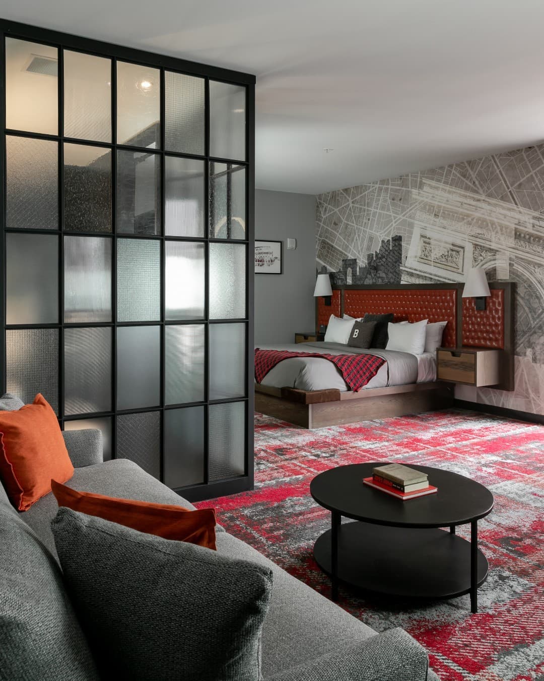 A bed and couch in a hotel room