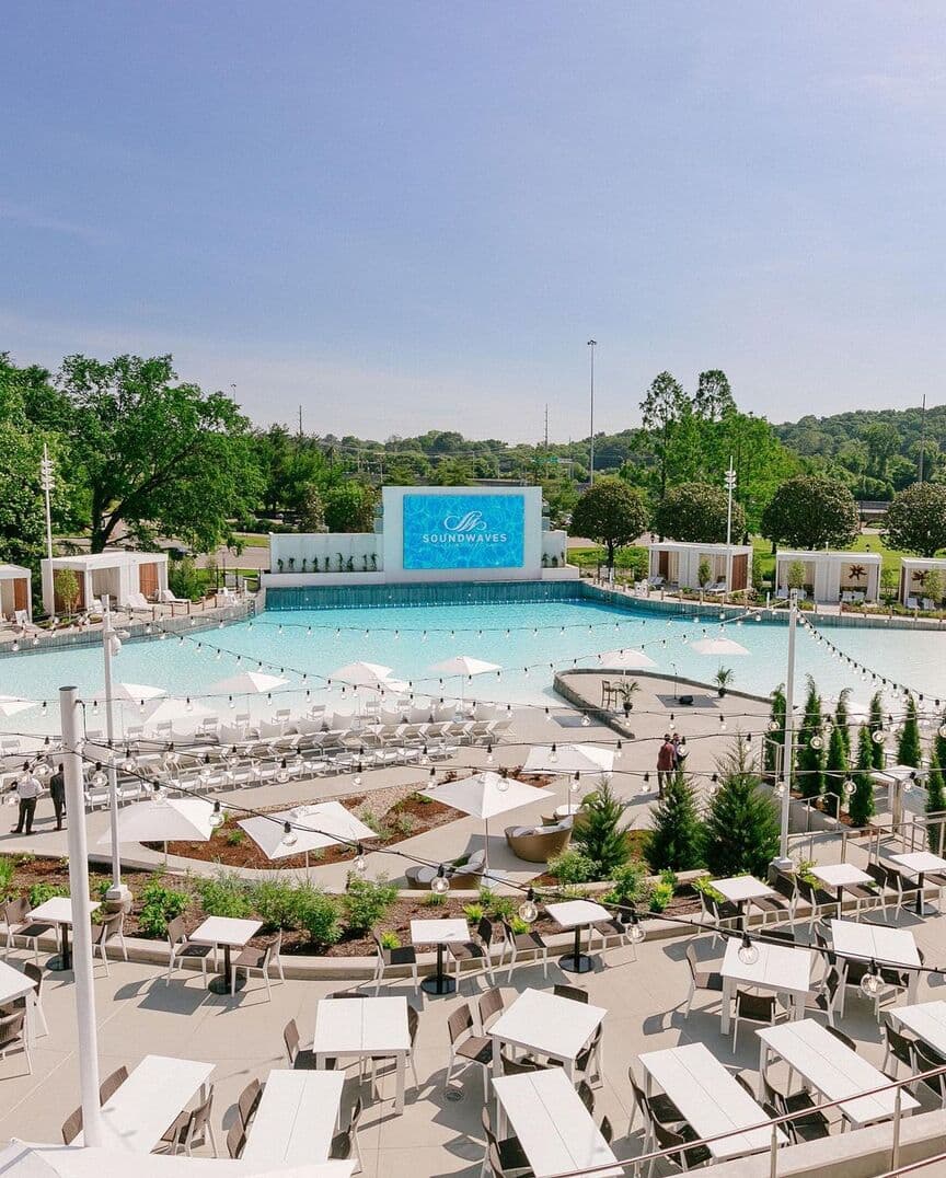 A movie screen by the pool at Soundwaves