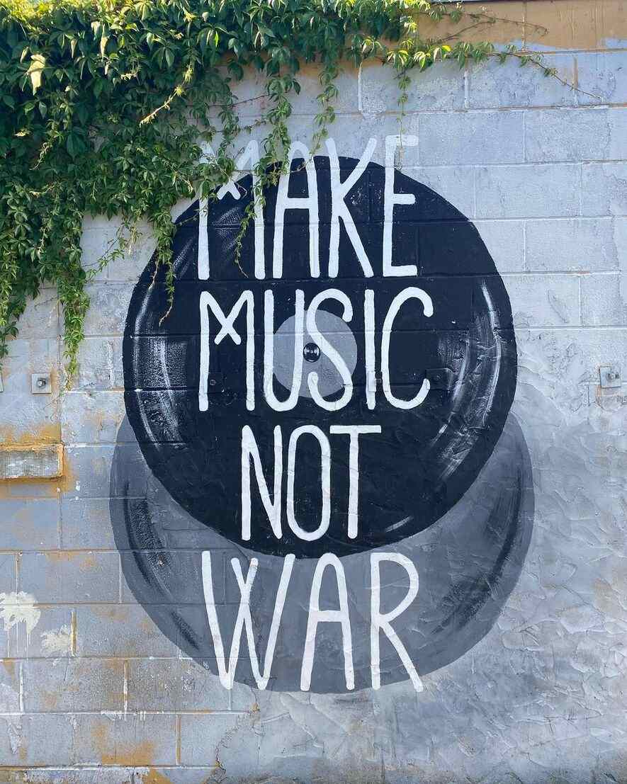 "Make Music Not War" sign
