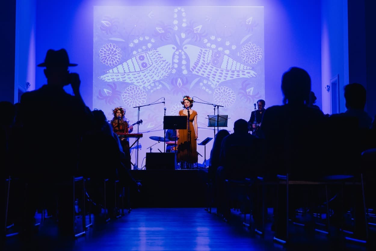 A concert with blue lights at Riverside Revival