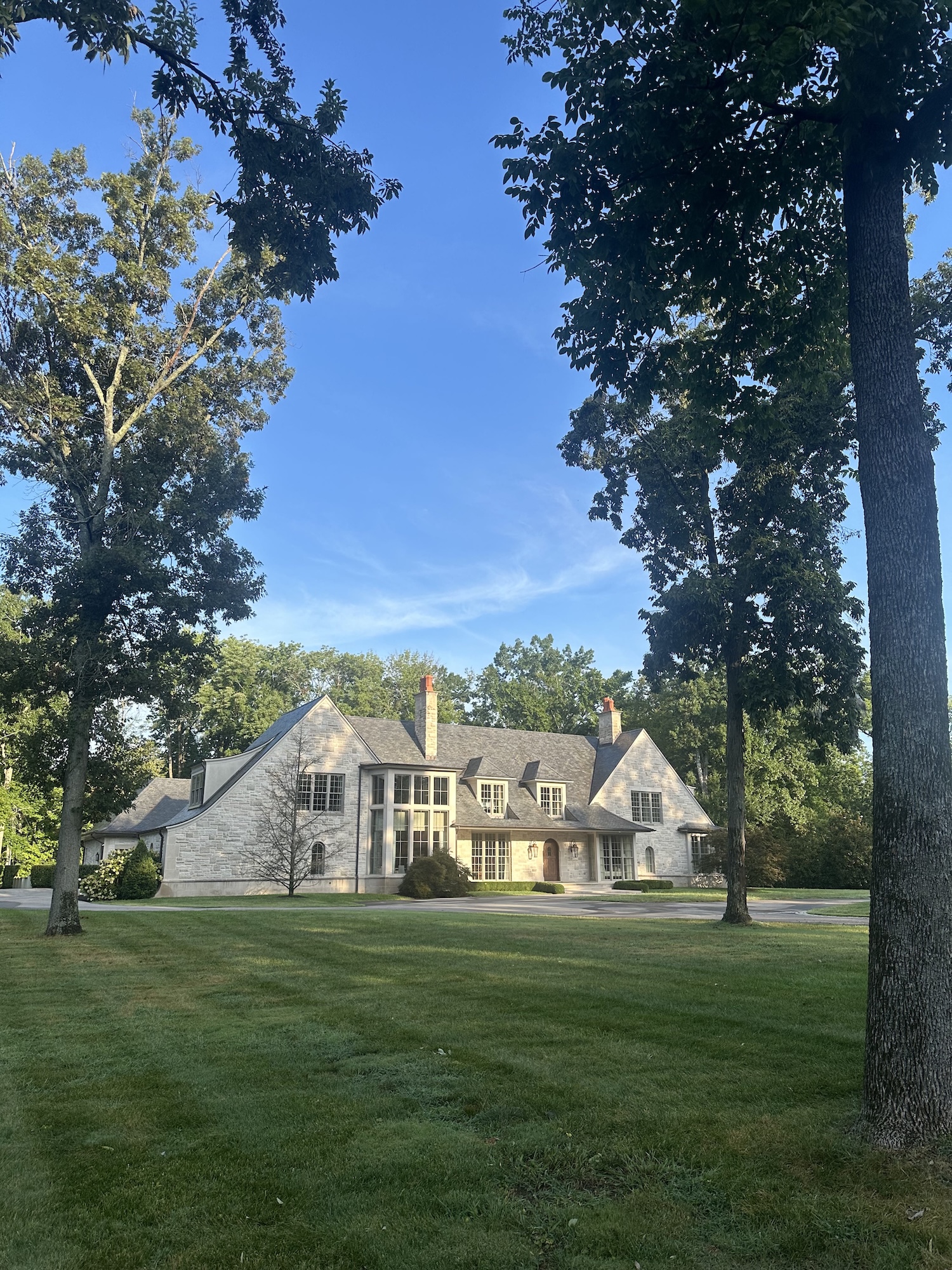 A beautiful stone houses and tall trees
