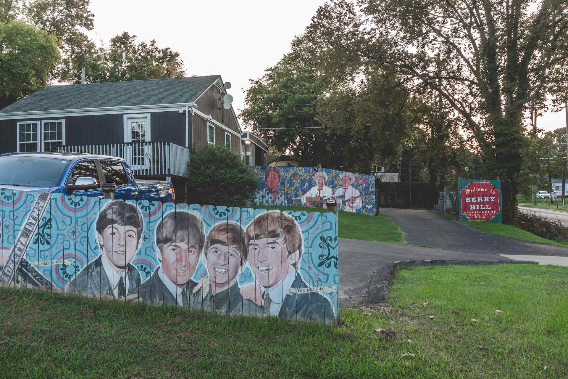 Berry Hill sign and Beatles mural on wall