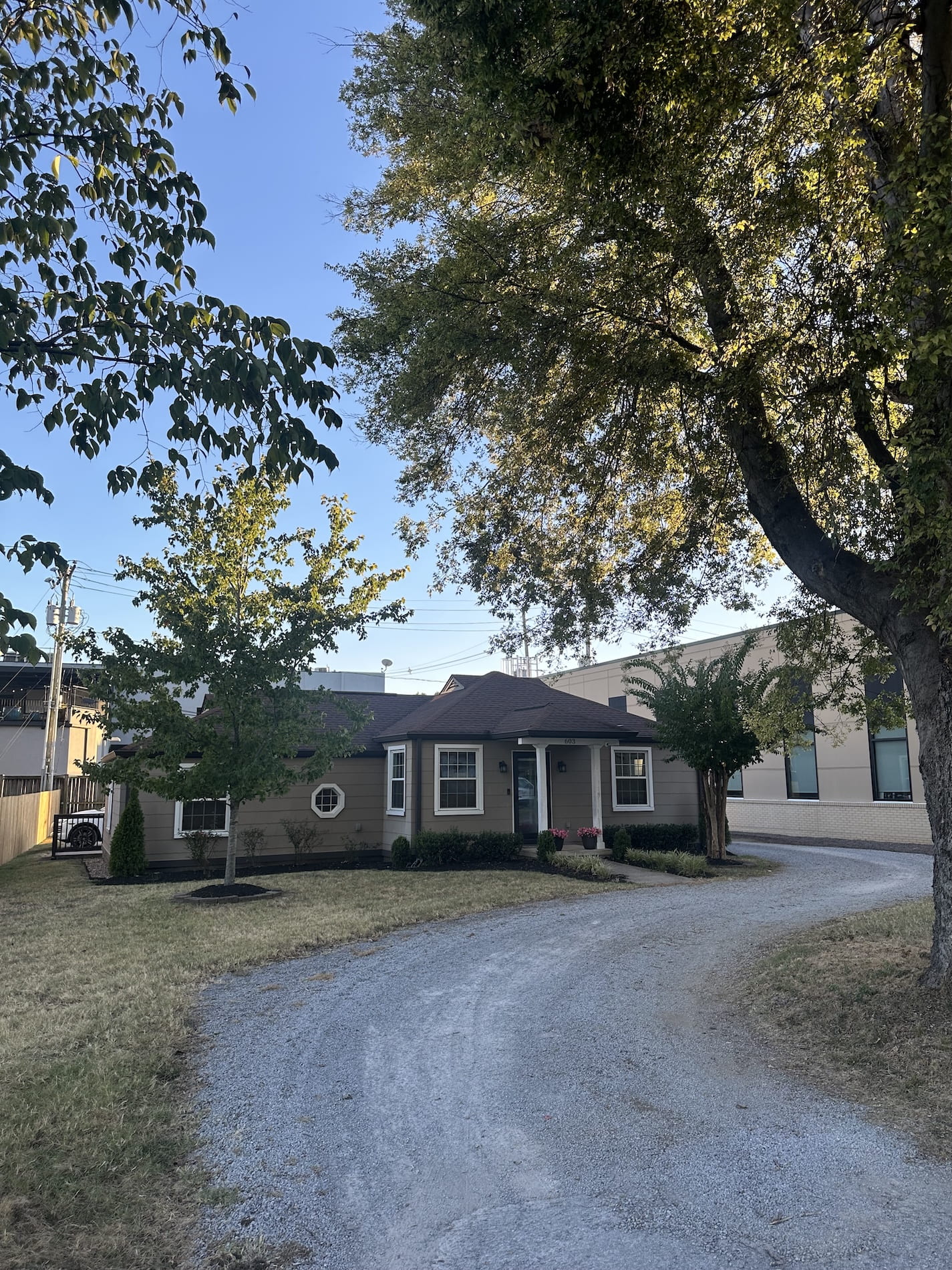 A small office house and it's gravel driveway