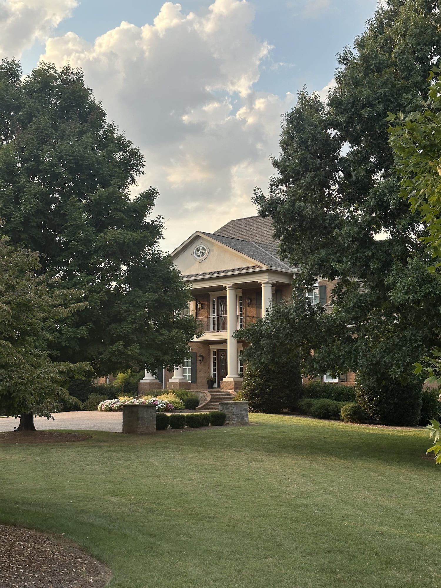 A brick mansion with columns