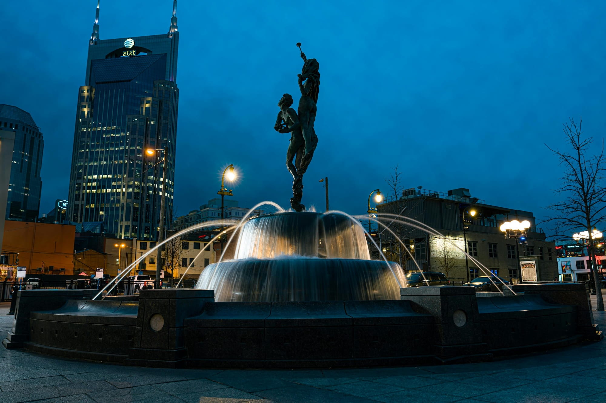 Girl sitting at Schermerhorn Symphony fountain