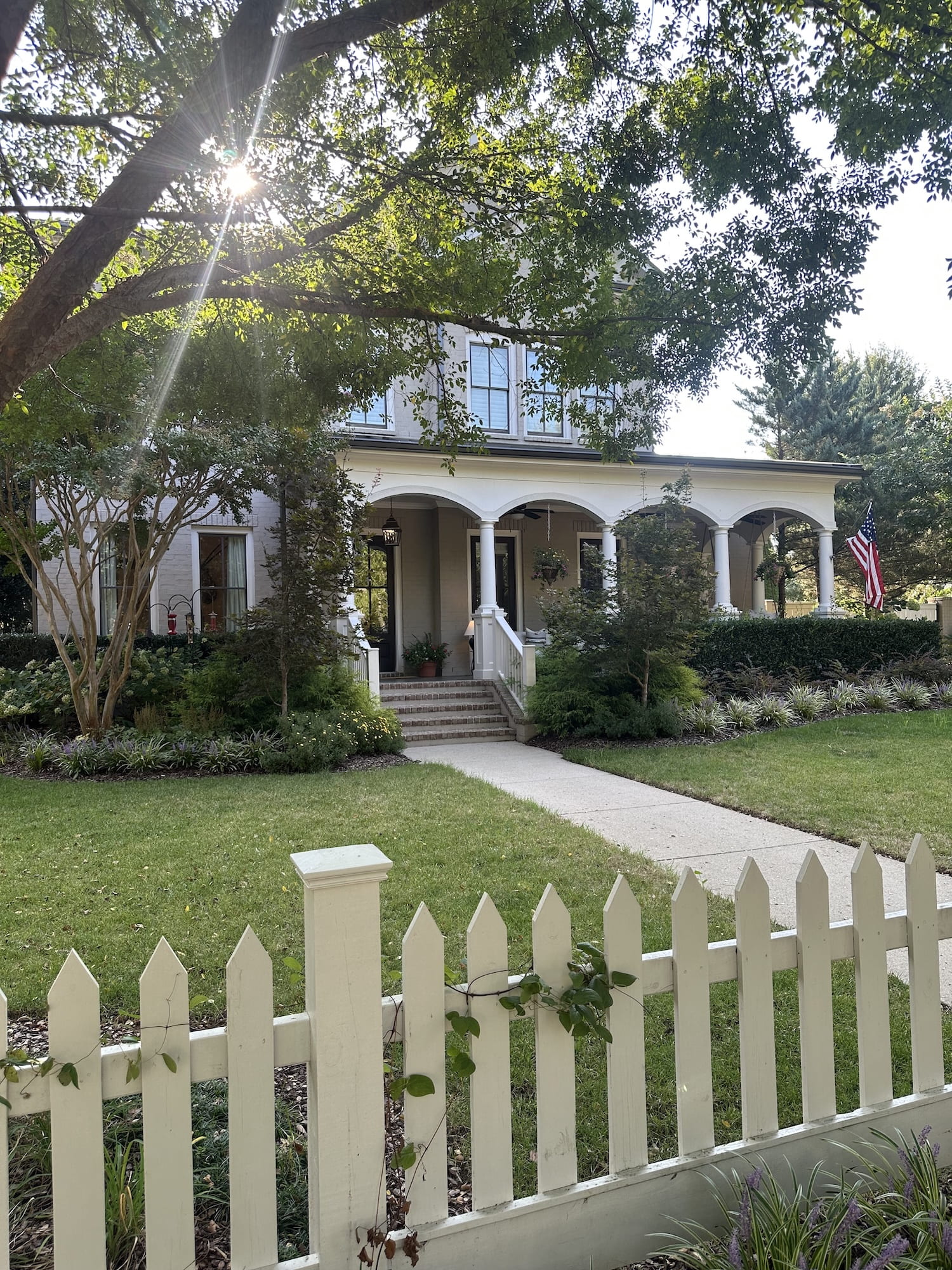 A nice house with a fence in the sun