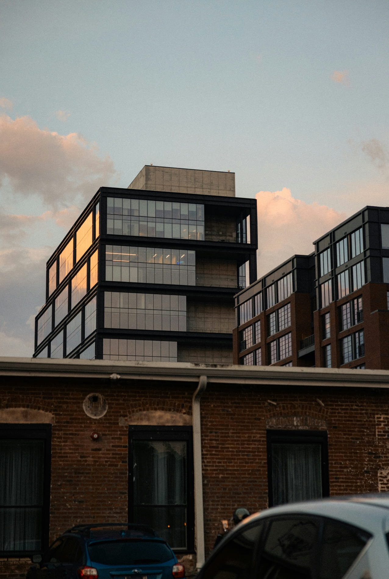 Brick building and modern building in background