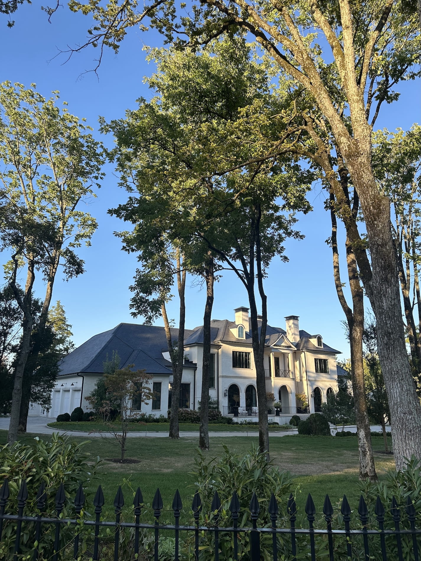 A stunning mansion with big trees