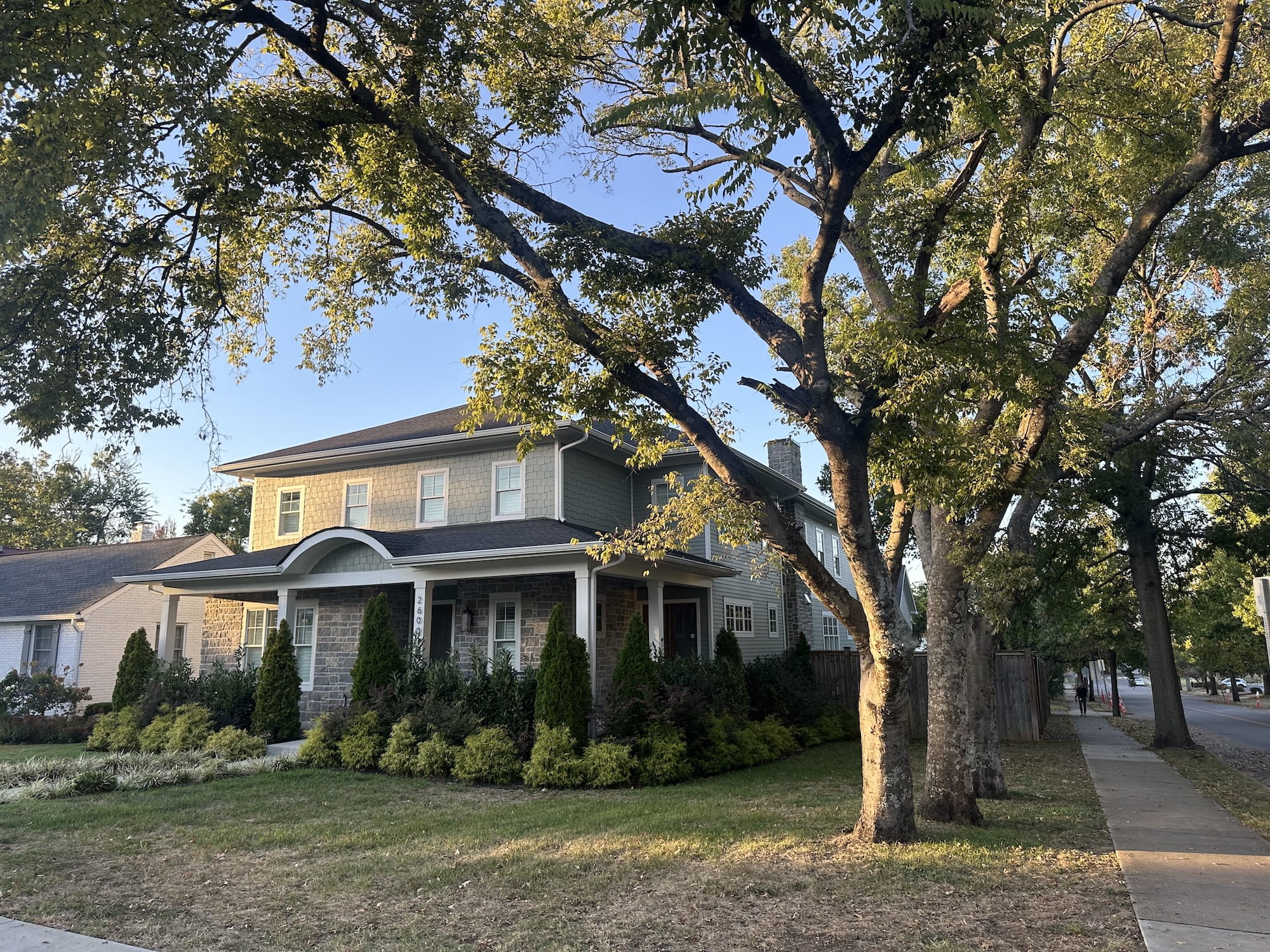 A big house on the corner of a street