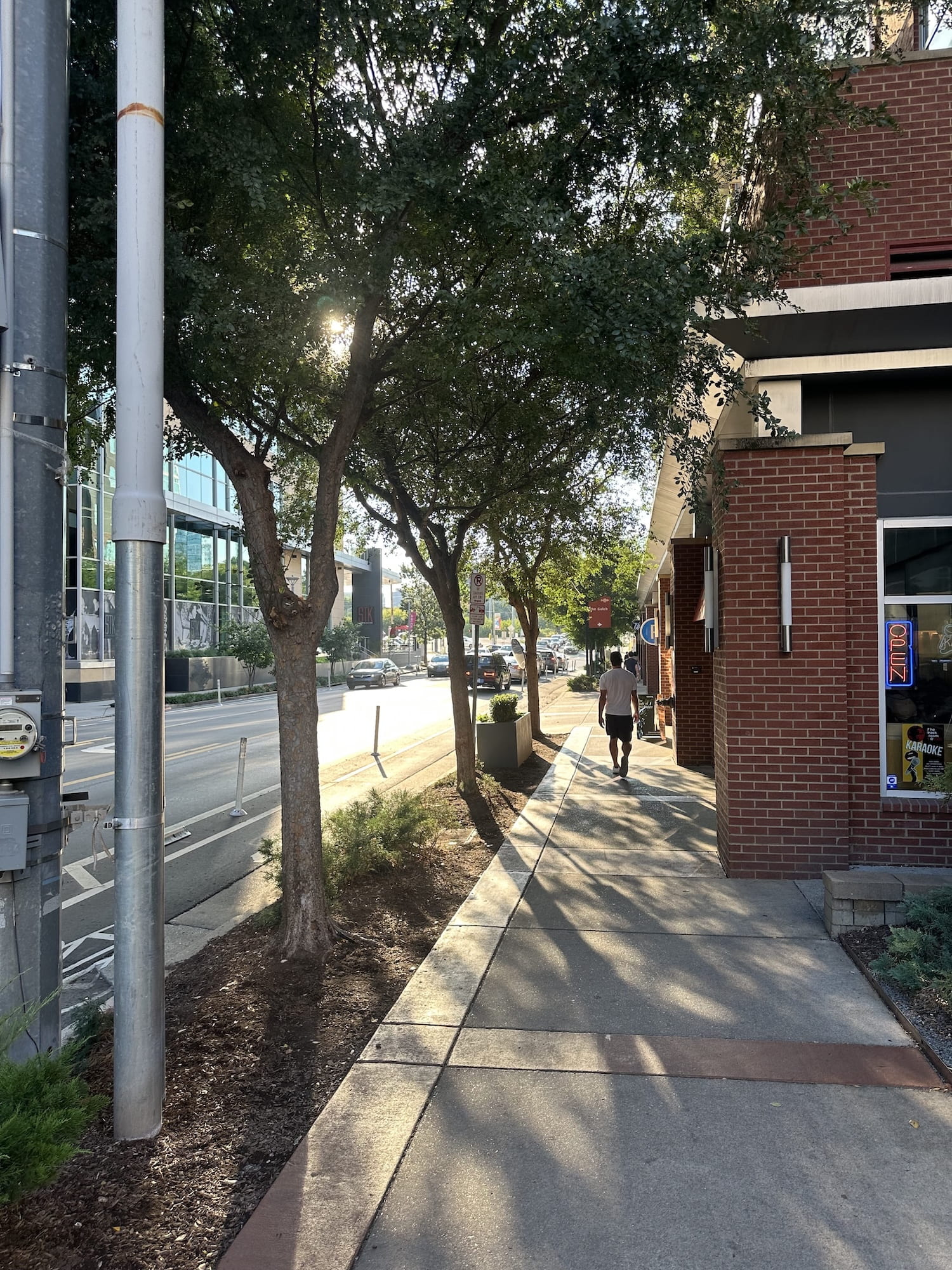 Sun shines on city sidewalks