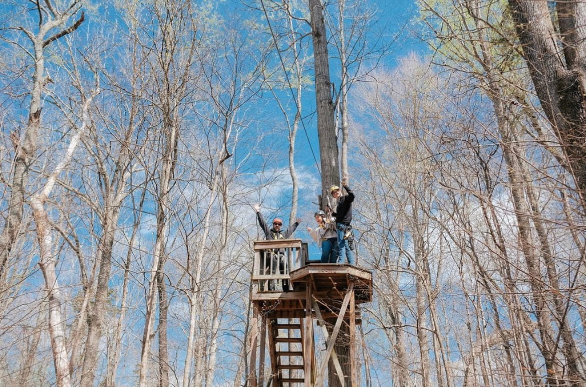 The crew that helps people in a zipline course