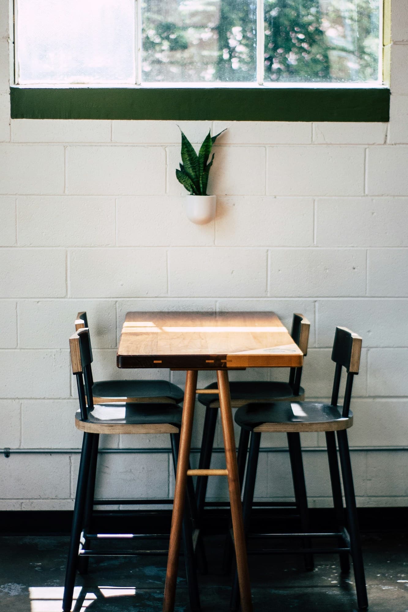 A table and stools at Barista Parlor