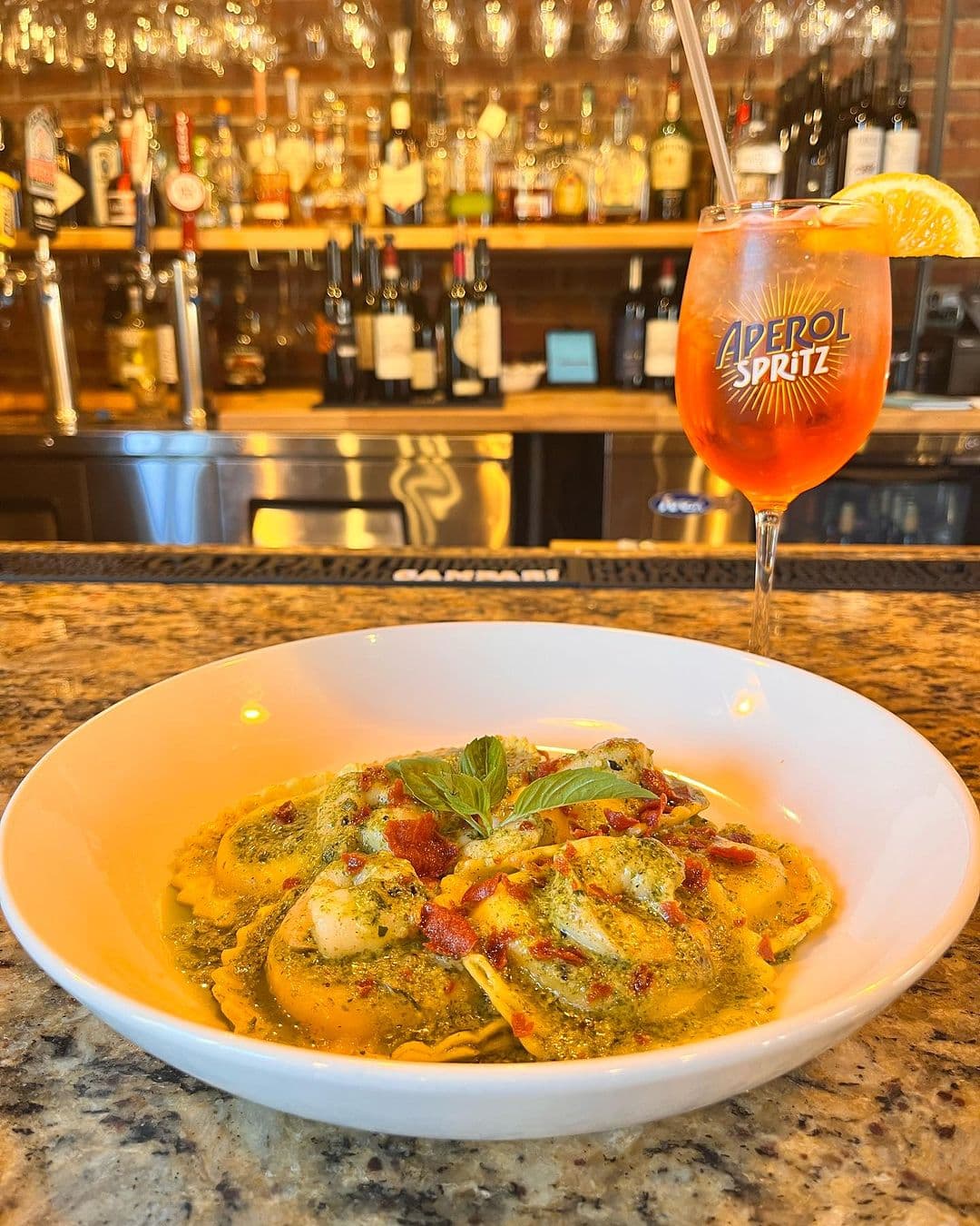 Green pasta and a spritz