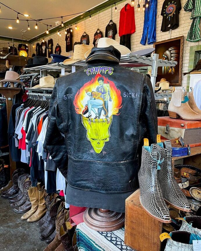 A vintage black jacket and some boots
