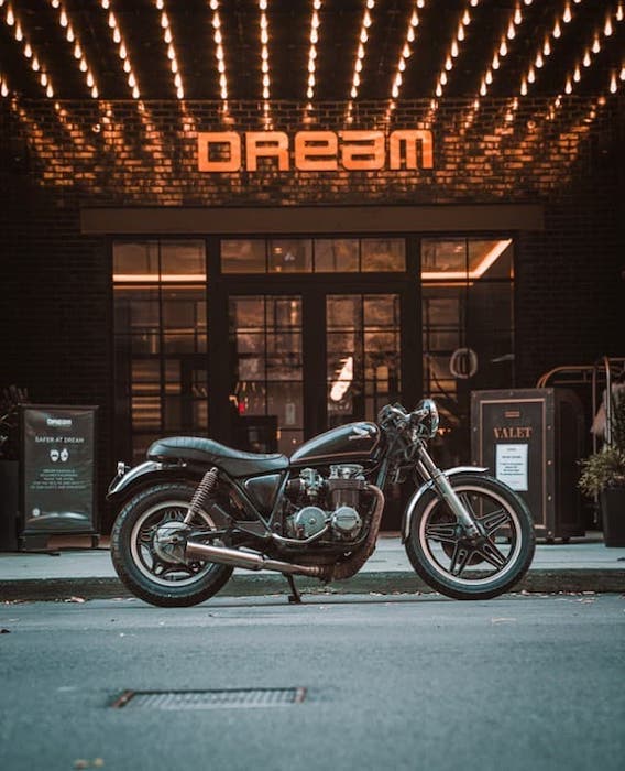 Dream motorcycle in front of sign
