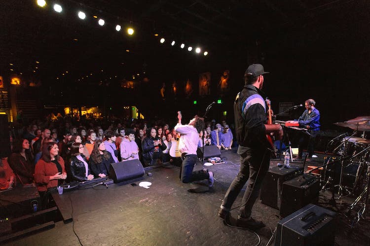 EXIT/IN view from behind stage