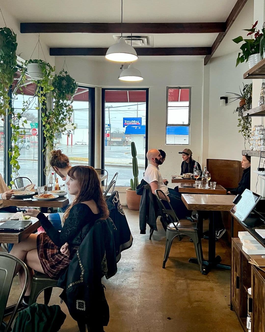 Tables and people dining inside Hearts