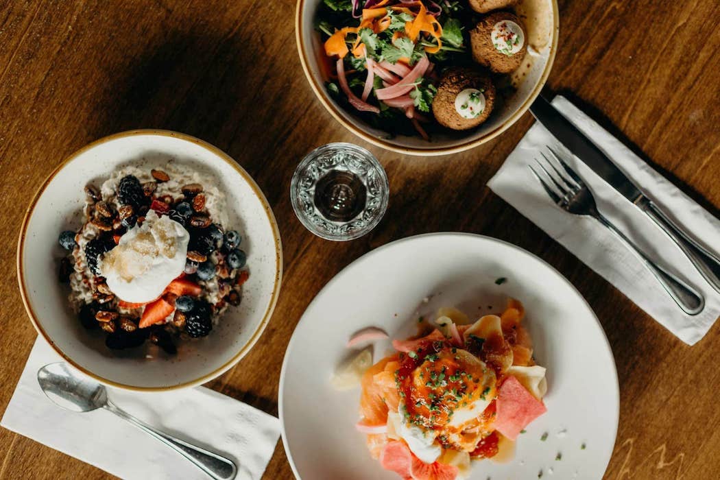 Three plates of delicious breakfast food