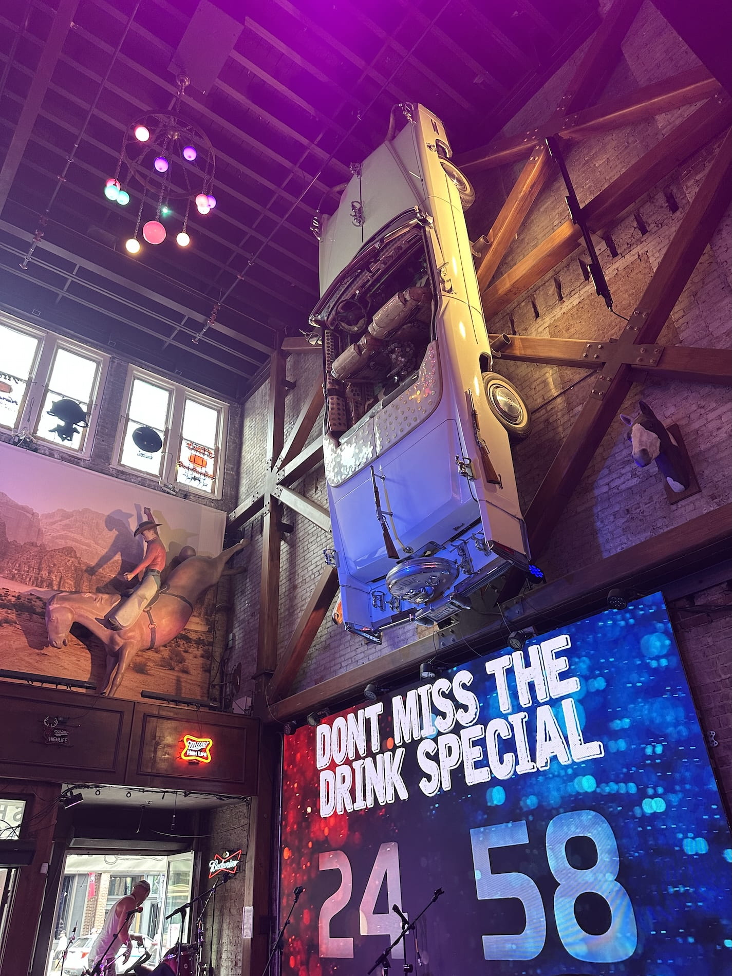 Nudies cadillac hangs above the front stage