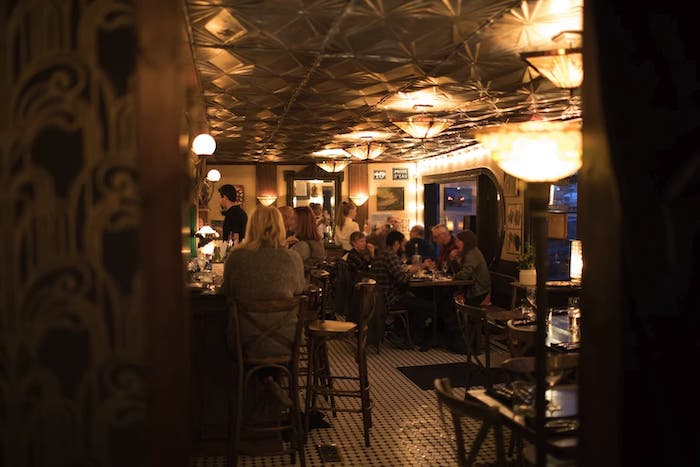 People eating at a french bistro