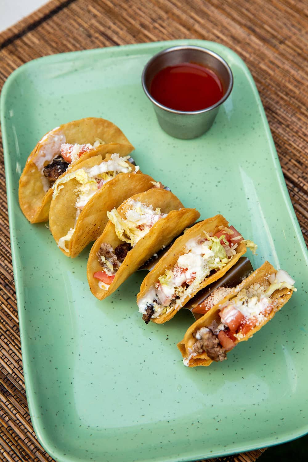 Tacos on an aqua tray