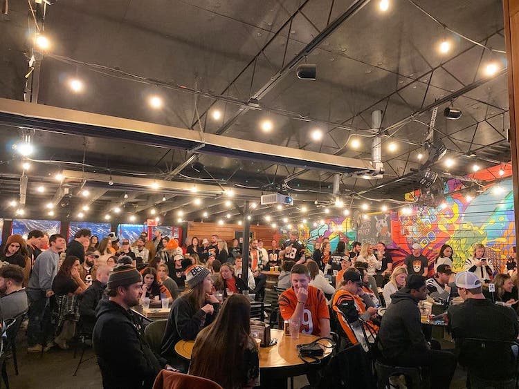 People inside a small brewery