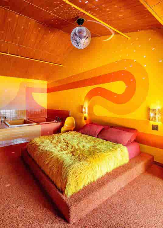An orange disco themed motel room