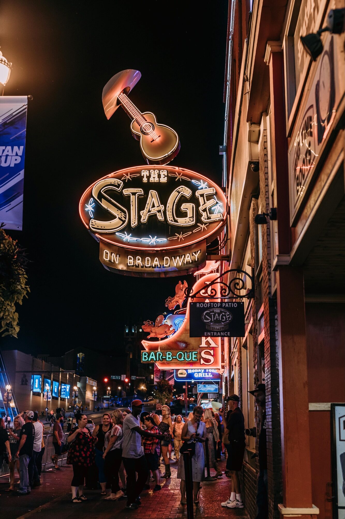 The Stage's sign at night