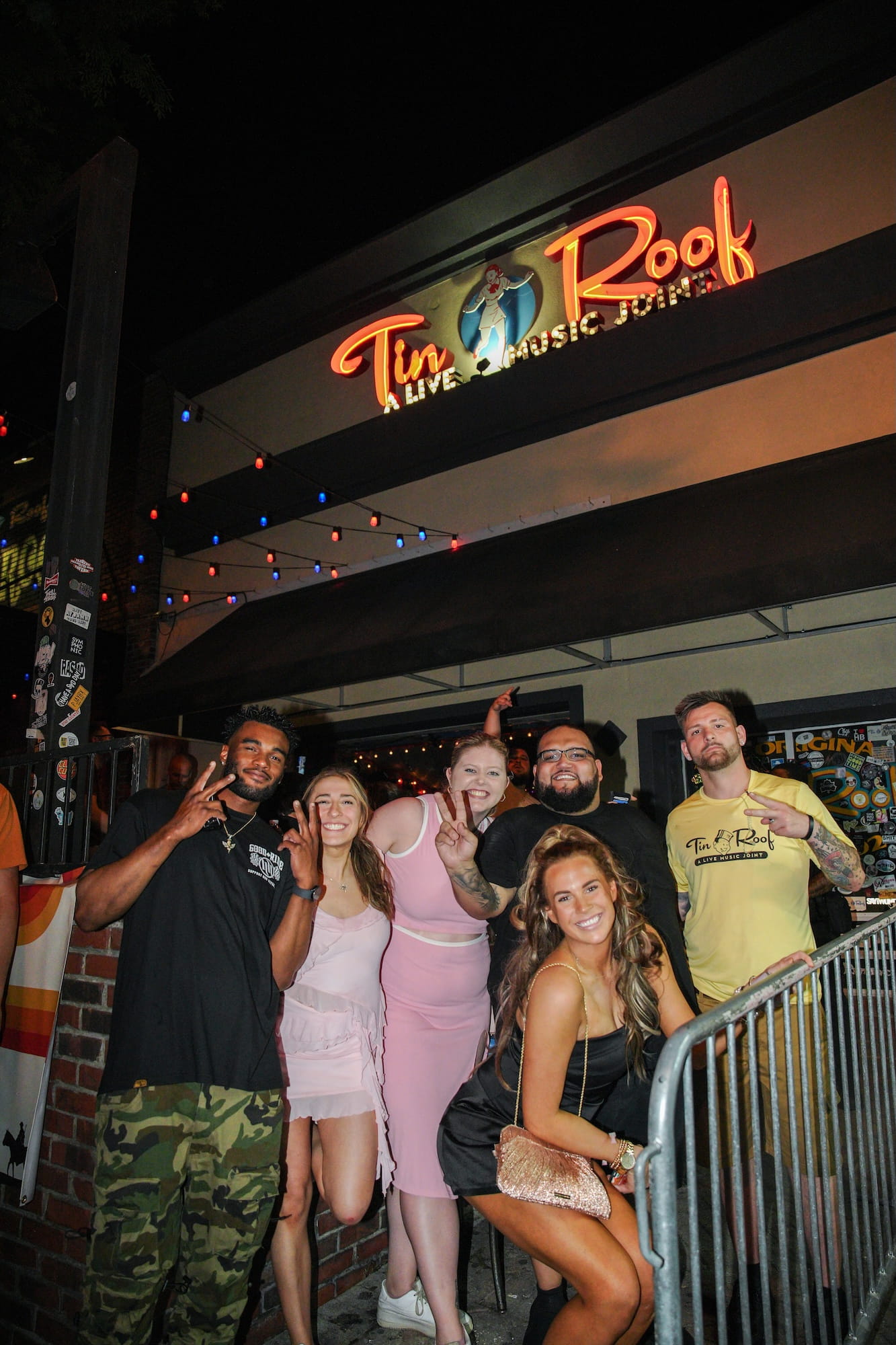 People standing outside Tin Roof Midtown