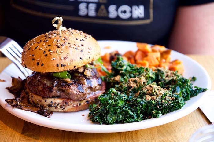 A burger and some greens