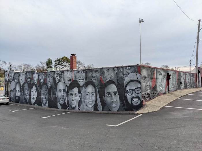 Comedian murals on outside walls at Zanies